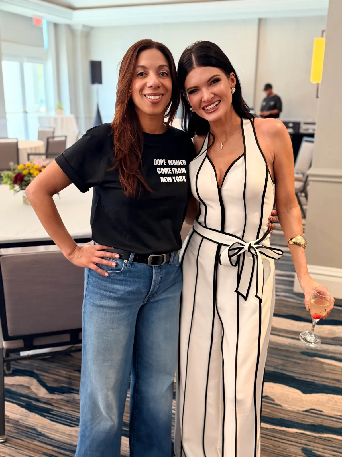 Katherine Torres-Pummill and Kellie Sbrocchi smiling together at a MIC 2026 reception.